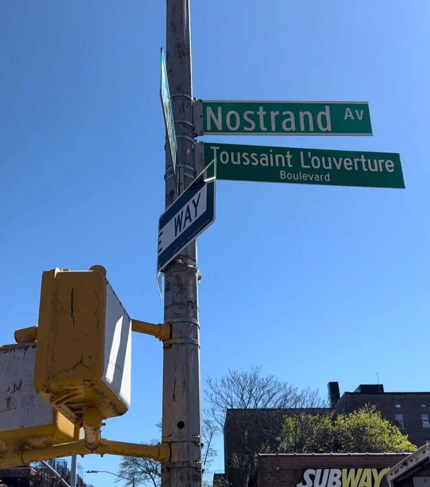 Toussaint L'Ouverture Boulevard street sign at Nostrand Avenue, Brooklyn